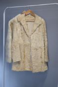 Two vintage Hutchesons fur coats, to include a blonde Persian-lamb style half lenght coat, size S,