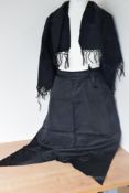 Two pieces of Victorian / Edwardian mourning wear, to include a silk half-apron with pointed hem,