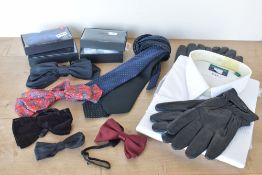 A collection of men's accessories, comprising a quantity of neck ties and bowties in various fabrics