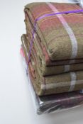 Two pairs of Dunelm eyelet curtains in 'Everett' burgundy and olive green tartan with off-white