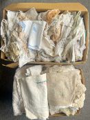 A quantity of cotton and other soft furnishings, furniture protectors, tablecloths, coasters,