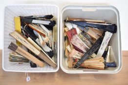 A quantity of 20th century handheld collapsible fans, various styles and designs, to include