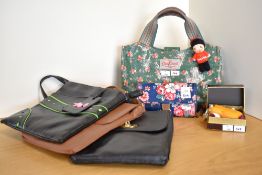 A collection of 2000s-modern handbags and purses, comprising a Cath Kidston green floral PVC