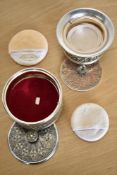Two vintage music-box powder-puff vanities, a Lady-Mate with concentric diamond design, makes a tune