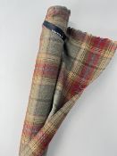 A bolt of Chess 100% wool tartan in Balmoral Jalepeno colourway, having a subtle green base with