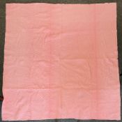 An antique Durham quilt in vibrant rose pink and baby blue cotton, showcasing the regional