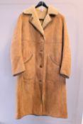 An unworn Nursey's Sheepskin three-quarter length coat in light tan suede and blonde shearling
