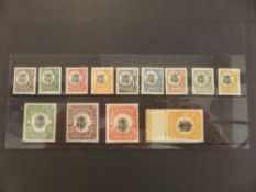 TANGANYIKA 1922-24 GIRAFFE DEFINITIVES SET OF 12 UPRIGHT WATERMARKS ON HIGH VALUES Card with set