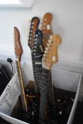 Five assorted sunburst electric guitars in various designs