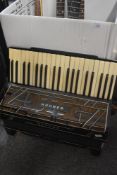 A Hohner Verdi III piano accordion