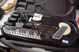 A Suzuki Q Chord digital songcard 'guitar' , with carry case and four soundcards