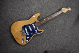 A composite made electric guitar, unbranded (stand not included)