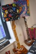 A pair of novelty guitar themed table lamps, the columns modelled from guitar necks