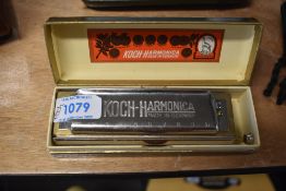 A vintage chromatic harmonica , Koch (Germany) with original box