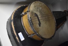 An early to mid 20th Century ukulele banjo, having 'British made' stamped to headstock, and engraved