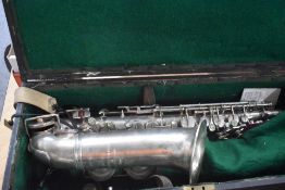 A Rampani and Cazzani , Saxophone, engraved Jepson, Eb HP , serial number 3039, with fitted wooden