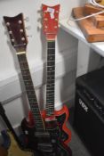 Two vintage electric guitars having Gibson SG style bodies, Kay branded scratch plates