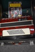 A Stella piano accordion, sold with case and tutorial book
