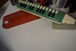 A vintage melodica , boxed