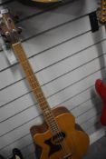 An as new Tanglewood electro acoustic bass guitar , left handed , model TW155A s/n YU140804043 (no