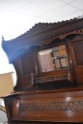 A 19thh Century American Organ or Harmonium (Crown Organ, Geo. P. Bent, Chicago) having mahogany