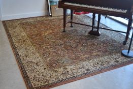 A Belgian style rug having cream and russet ground with animalistic and foliate design, approx.