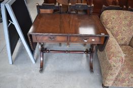 A reproduction Regency style sofa style side table, approx. 91 x 55cm