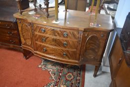 A reproduction Regency sideboard having shaped front, width approx. 138cm