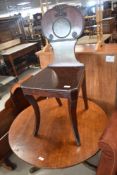 A George III mahogany hall chair having transfer date to back panel cartouche in Roman Numerals
