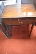 A 19th Century mahogany work table having two drawers including beize desk section, on turned