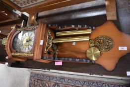 A reproduction wall clock having tower bridge decoration to brass and silvered dial