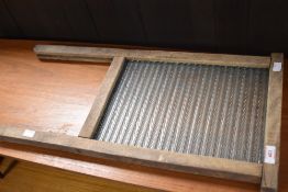 A traditional wooden framed moulded glass washboard 64.5cm
