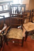 A 19th Century spindleback carver chair having rush seat