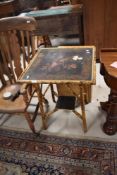 A Victorian style bamboo occasional table having laquer work top (af), approx. 58 x 58cm