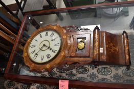 A 19th Century continental style wall clock having ornate marquetry decoration with circular Roman