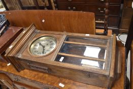 An early 20th Century mahogany cased wall clock having silvered Arabic numeral to dial, case in need