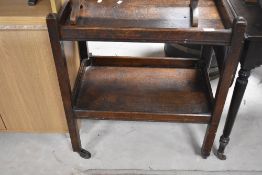 An early 20th Century oak tea trolley, approx 43 x 67cm