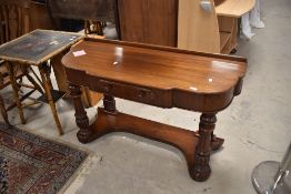 A Victorian mahogany side table having frieze drawer and turned legs, dimensions approx. H72 W120