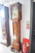 An 18th Century Scottish longcase clock having 8 day movement with blind fretwork to hood having