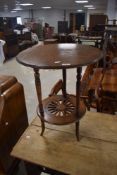 A Victorian mahogany occasional table having circular top and pierced undertier, diameter approx.