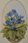 An attractive oval botanical watercolour, a depiction of primroses, indistinctly signed Hazel T