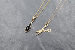A 9ct gold onyx set pendant, the teardrop onyx panel in a bezel setting on a 9ct gold box chain,