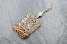 A Chinese carved agate rectangular pendant depicting a deer with tree having a cord and bead loop,
