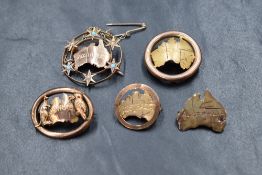 A group of five 9ct and yellow metal Australian motif brooches, all having the outline of Australia,