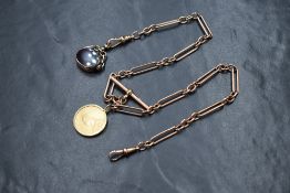 A 9ct rose gold paper clip link watch chain, having dog clips, T-bar and a 9ct gold bloodstone and