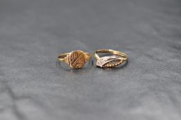 A 9ct gold child's signet ring, the square panel having scroll engraving and rubbed initials,
