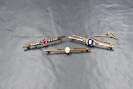 A 9ct gold opal set bar brooch, the oval opal cabochon in a bezel setting, marked 9ct, along with