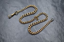 A 9ct gold graduated curb link watch chain, having a dog clip closure and additional links for fobs,