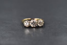 A 9ct gold cubic zirconia set three stone ring, the central cubic zirconia measuring approximately