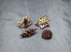 A yellow metal amethyst and citrine floral pendant, the flower motif set with two oval cut